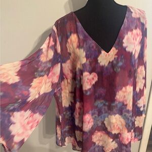 Beautiful long angel sleeve top with inside camisole.